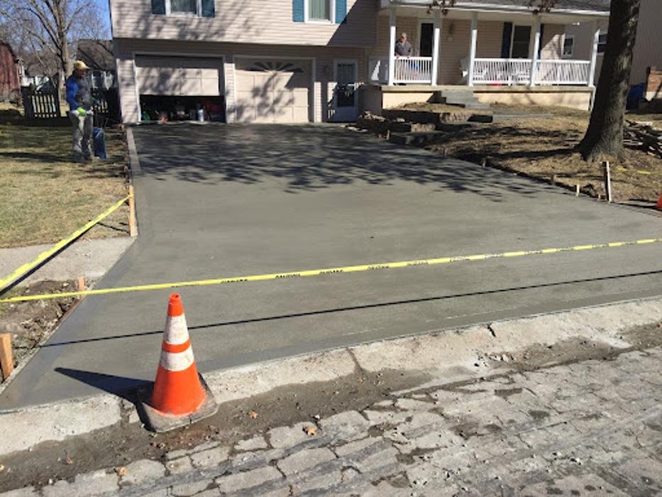 Concrete driveway replacement in progress in east Kansas City — base preparation before pour